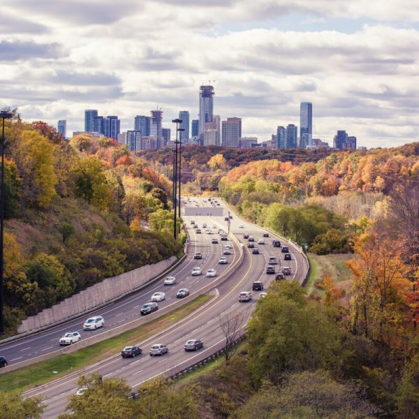 aerial-photography-of-passing-vehicles-on-highway-leading-to-city